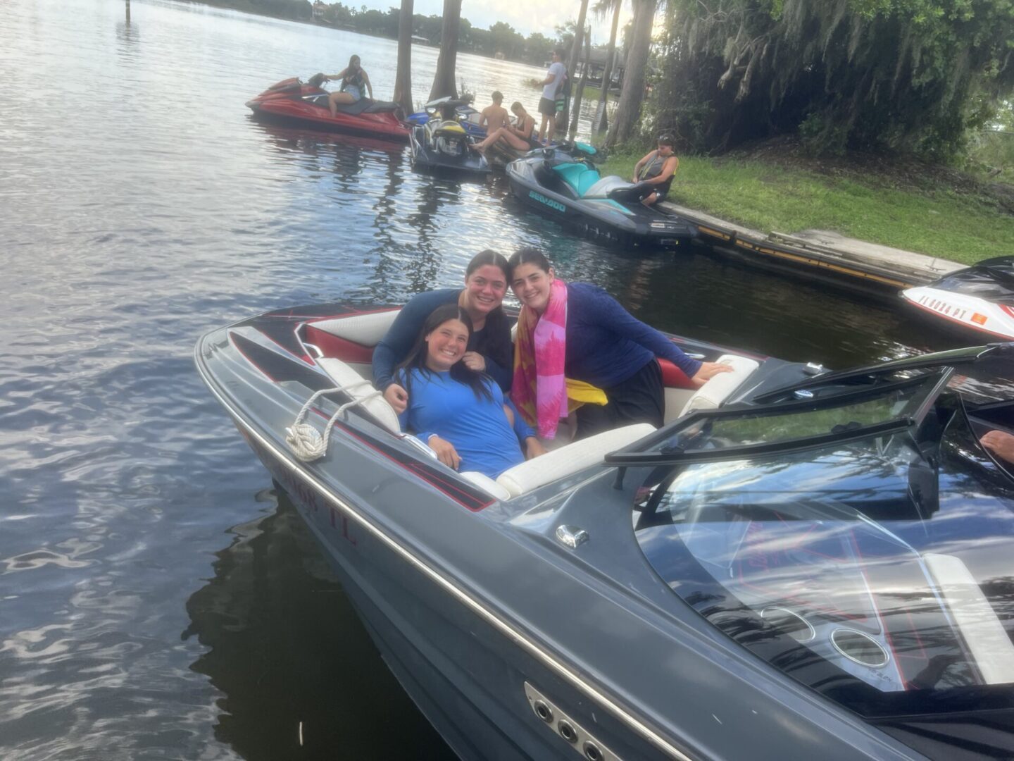 Family enjoying a boat ride on a calm lake.