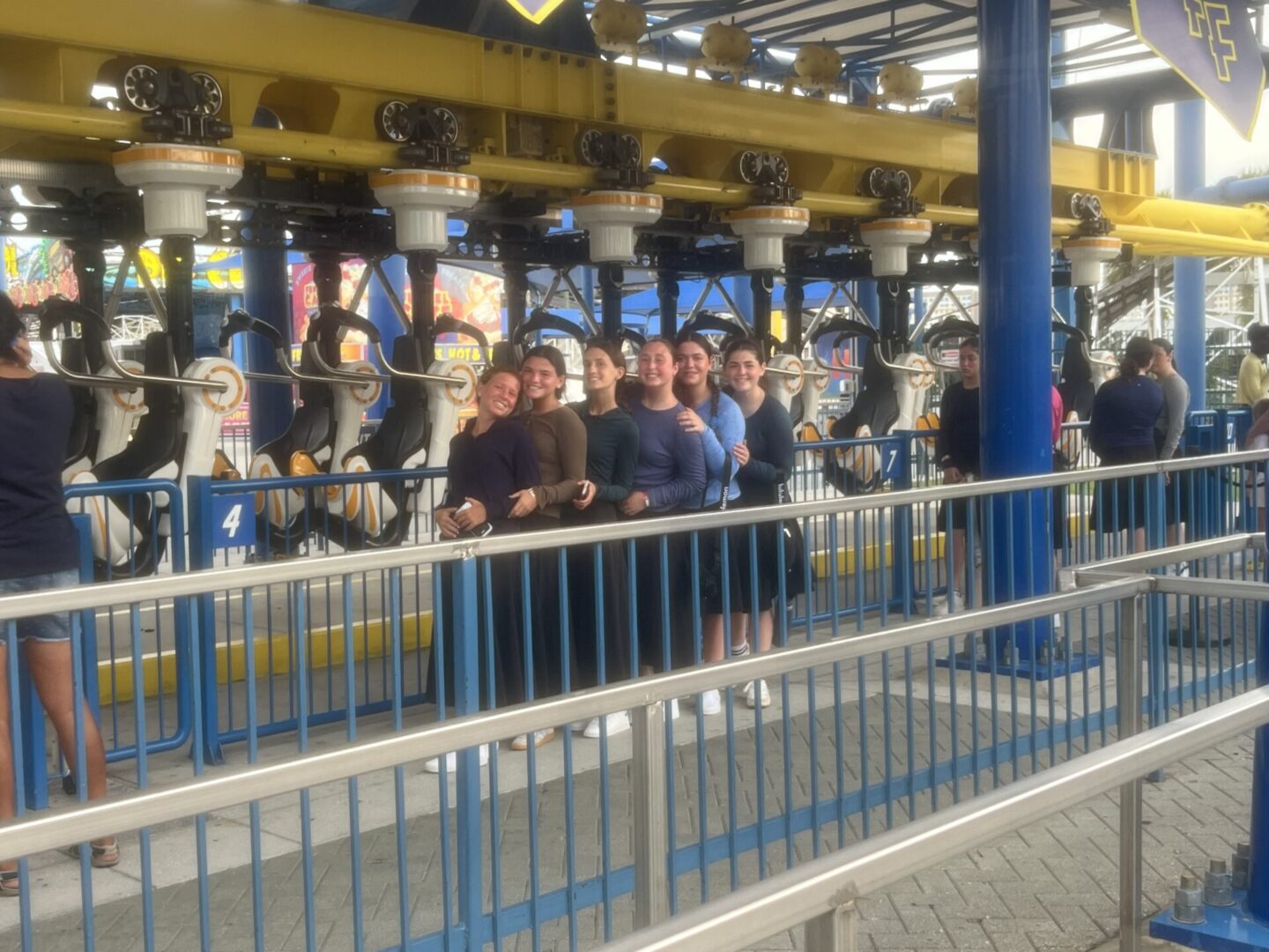 Group of people waiting in line at an indoor amusement ride.