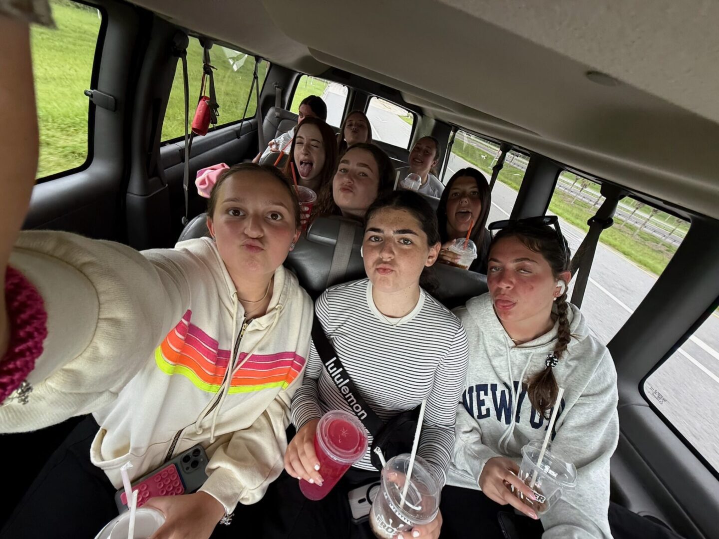 A group of friends enjoying a fun bus ride together.
